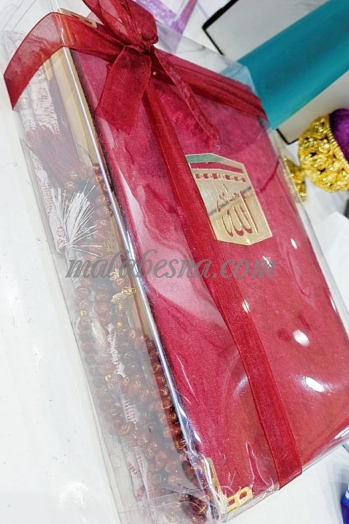 Box containing Holy Quraan small Rosary and praying carpet