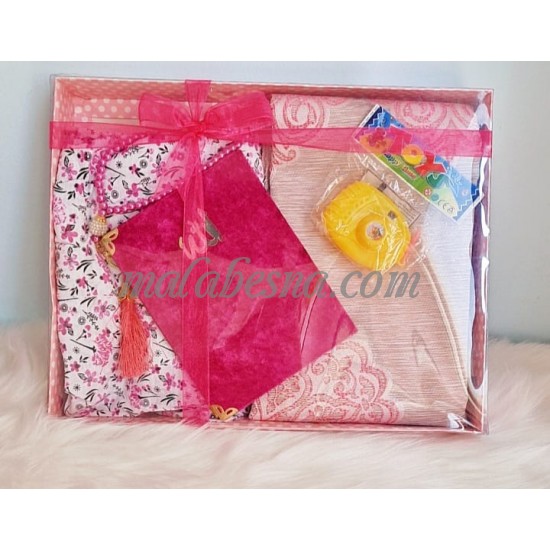 Box containing kids praying clothes Holy Quraan Rosary and a toy