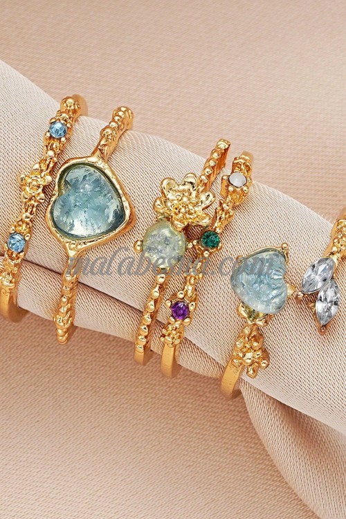 3 golden Rings set with purple heart