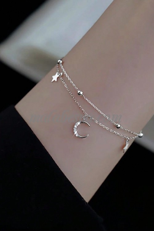 Silver bracelet with moon and stars