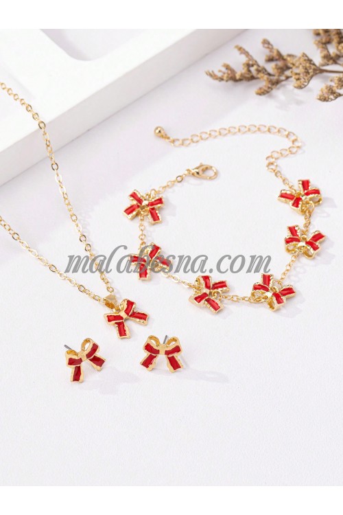 Golden set of earrings necklace and bracelet with bow tie