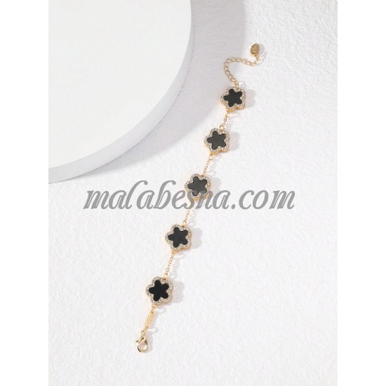 Golden bracelet with black flower and diamonds