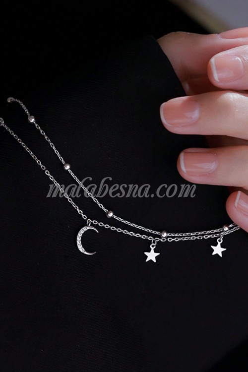 Silver bracelet with moon and stars