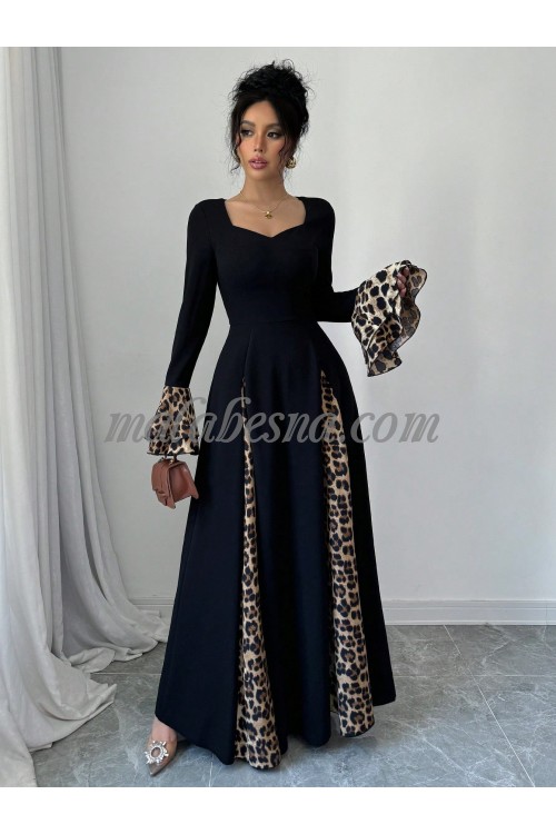 Black dress with tiger pattern below and on the sleeves