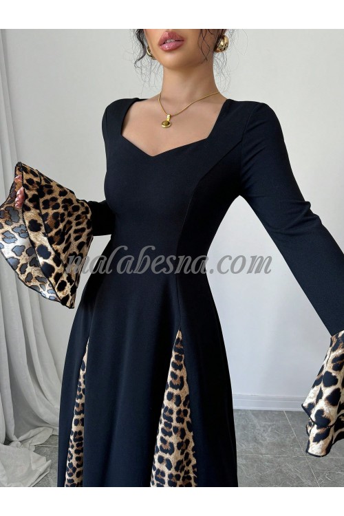 Black dress with tiger pattern below and on the sleeves