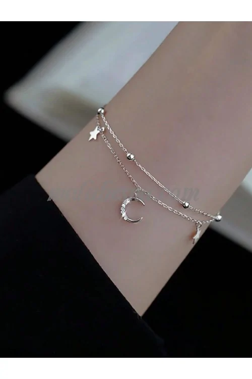 Silver bracelet with moon and stars