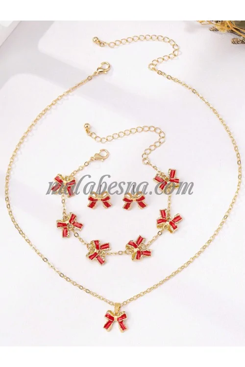 Golden set of earrings necklace and bracelet with bow tie