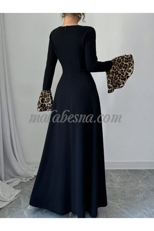 Black dress with tiger pattern below and on the sleeves
